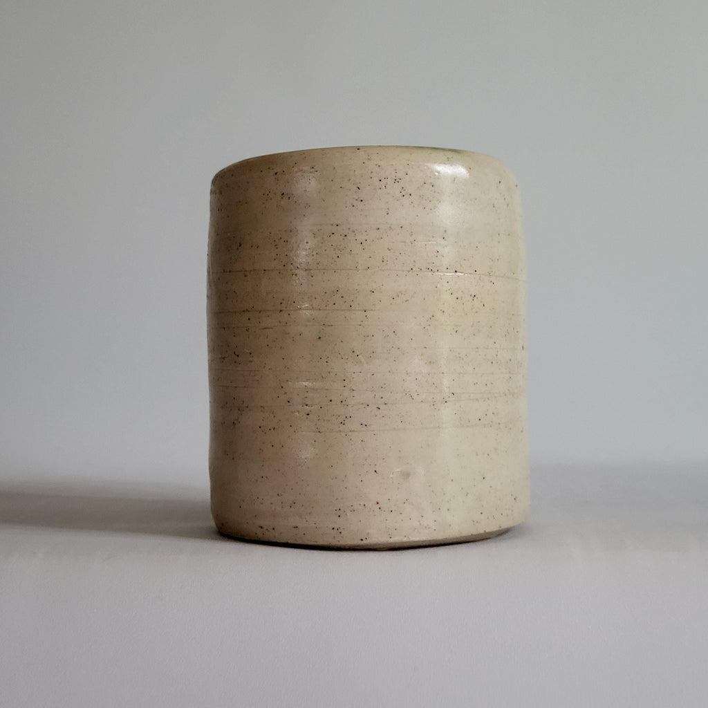 Tea Cup, Buddha face, serene happy face carved design.
