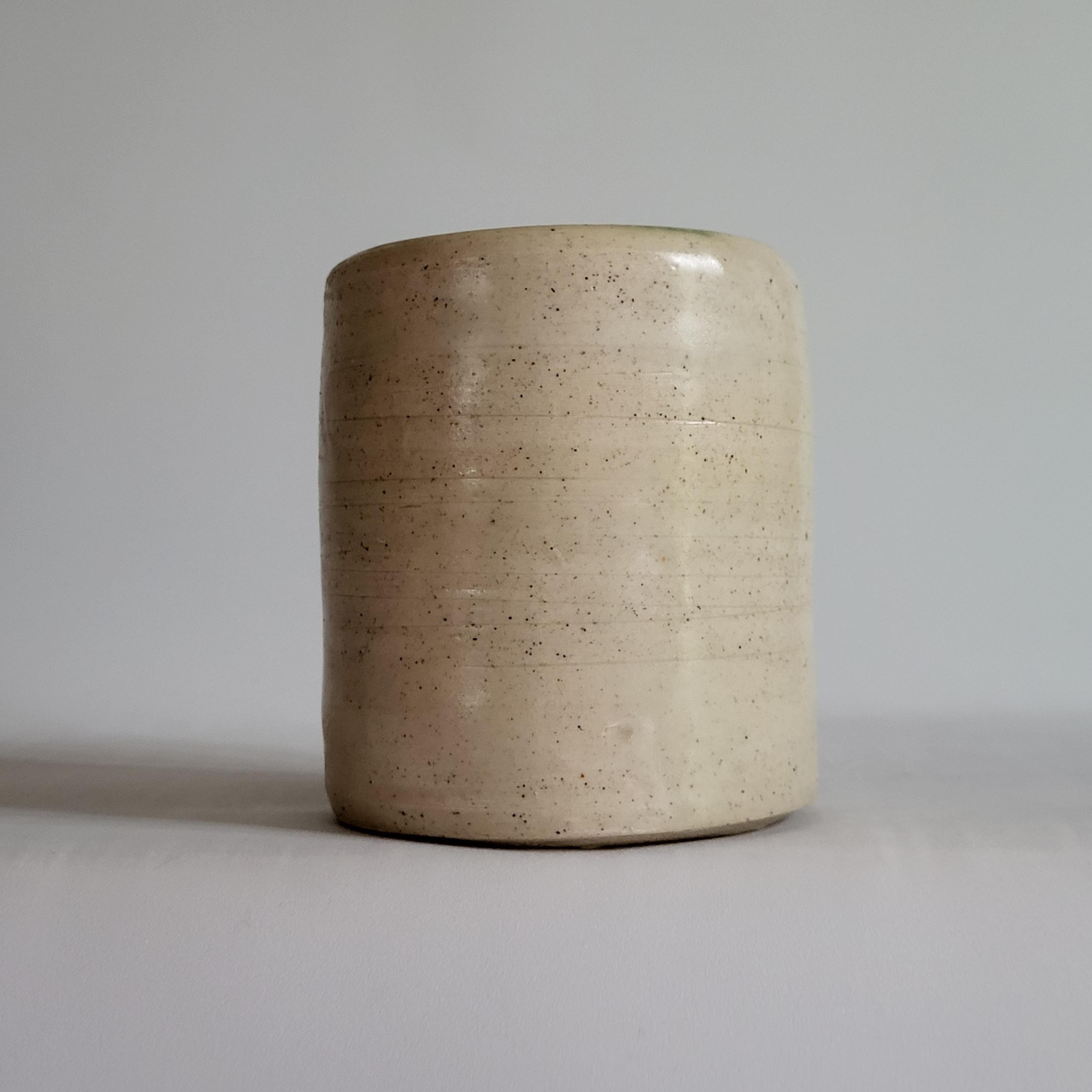 Tea Cup, Buddha face, serene happy face carved design.