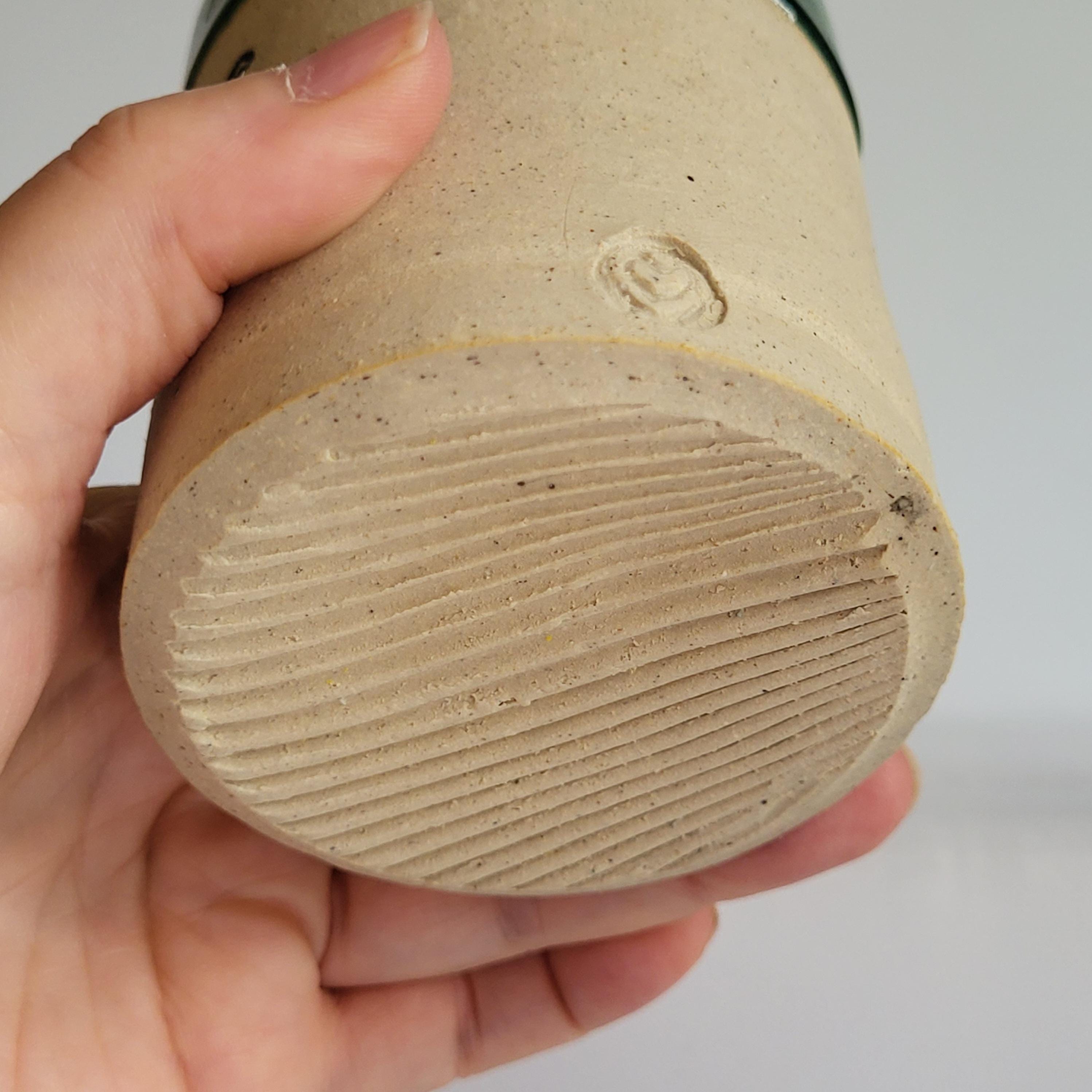 Tea Cup, Buddha face tea cup, serene happy face carved design. green glaze hat