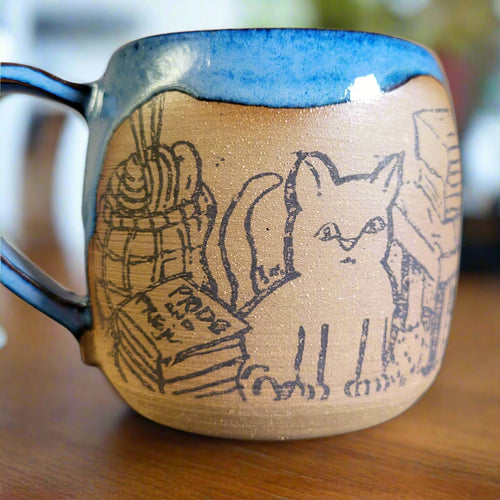 Cozy cat and books at home mug