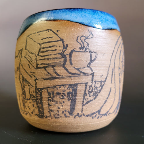 Cozy cat and books at home mug