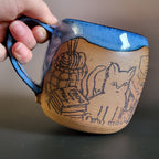 Cozy cat and books at home mug