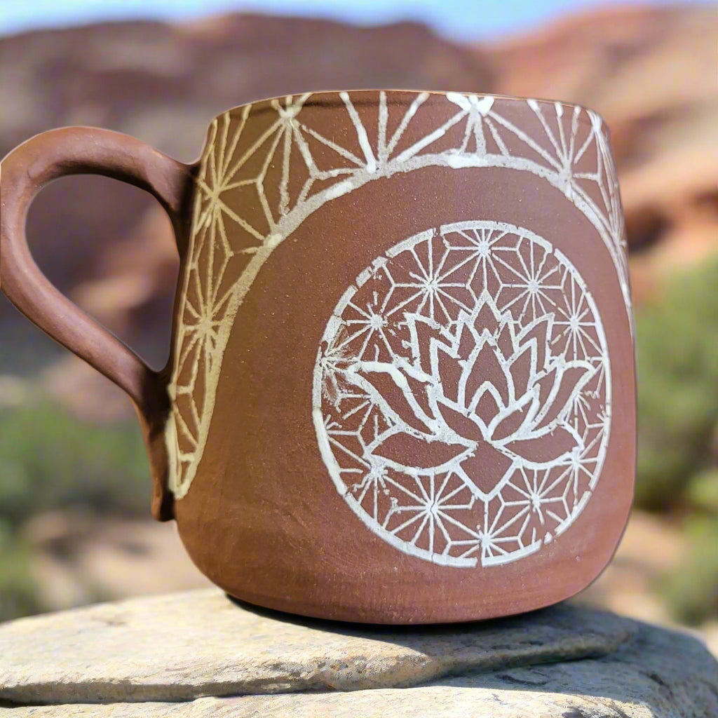 Ceramic mug with geometric patterns on a neutral background
