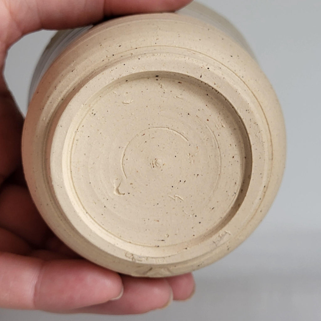 Tea Cup small size with simple carved design and beige off white glaze