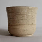 Tea Cup small size with simple carved design and beige off white glaze
