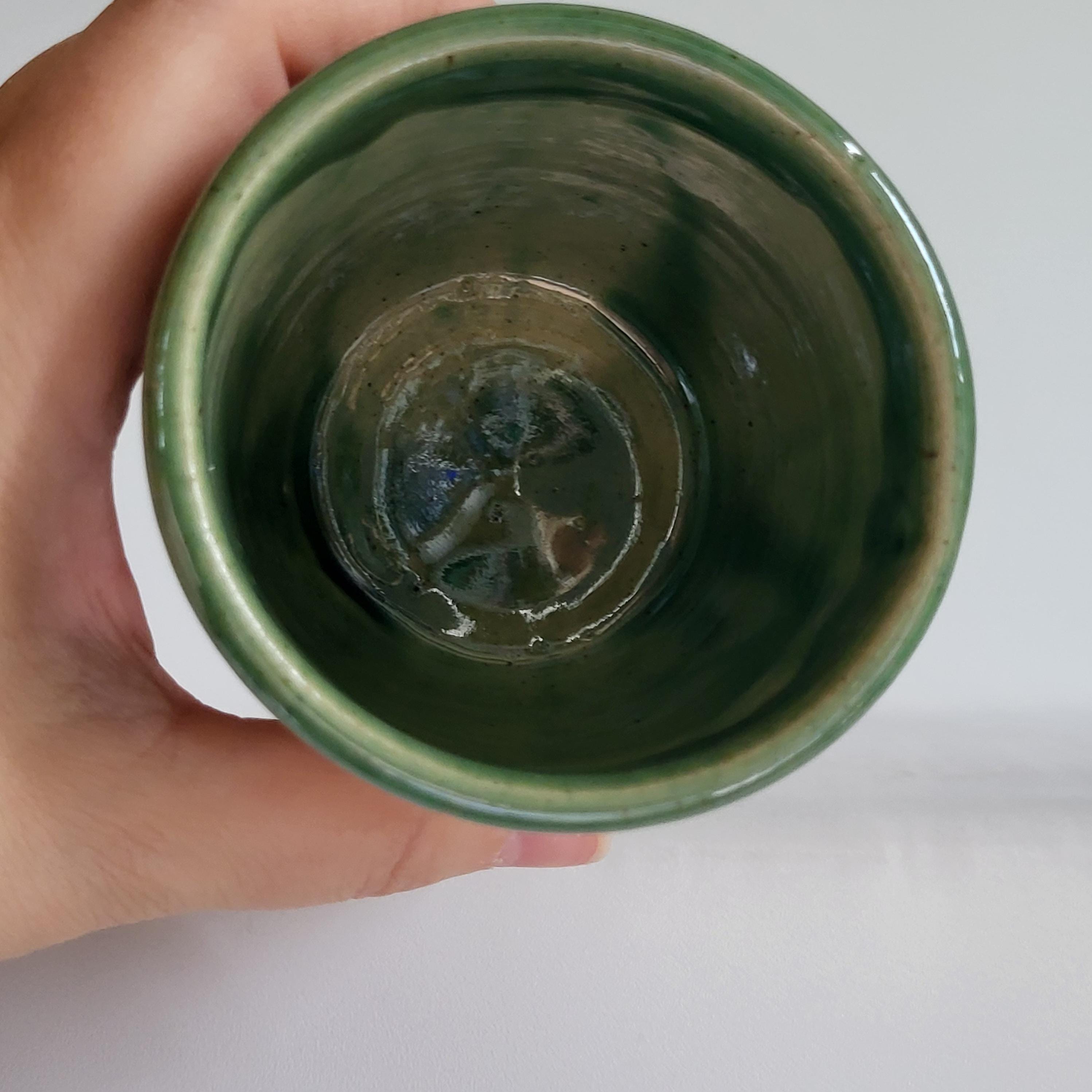 Tea Cup, Buddha face tea cup, serene happy face carved design. green glaze hat