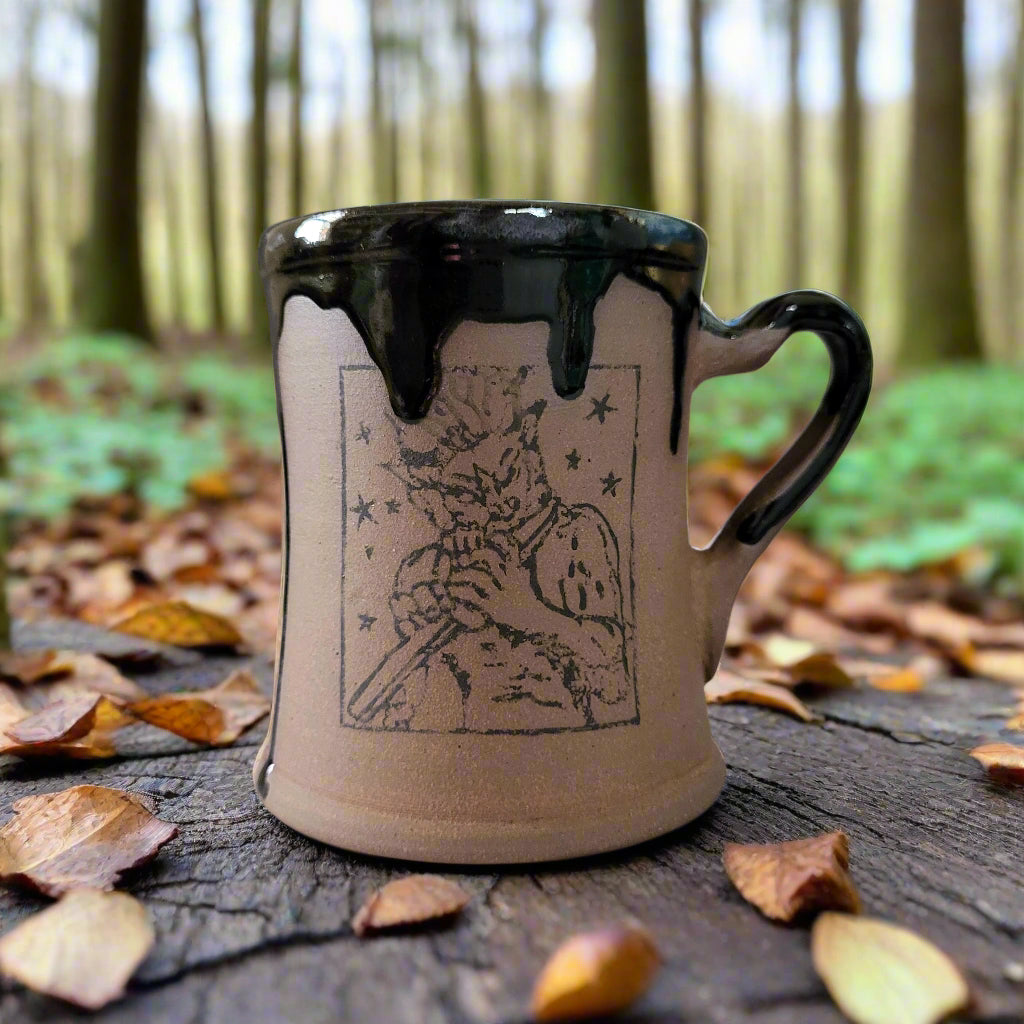 Pagan Pan mug holding flute